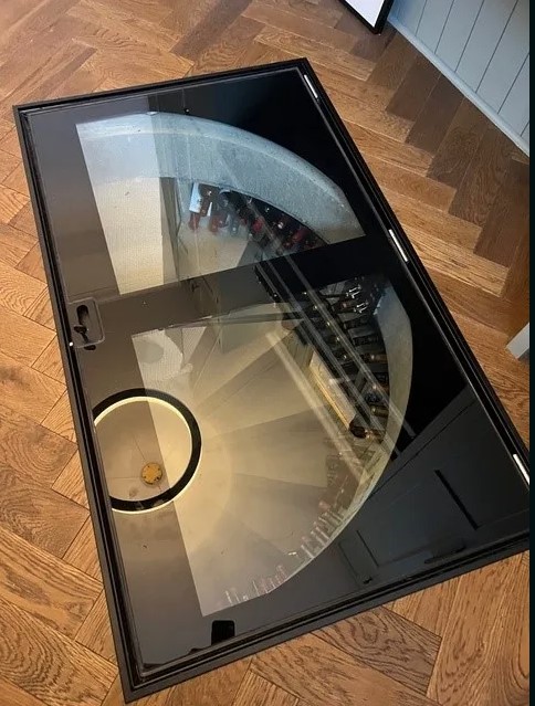 Semi-Circular Concrete Spiral Cellar Glass Door